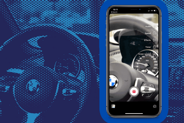 A smartphone taking a facebook reel of a test drive in a car dealership
