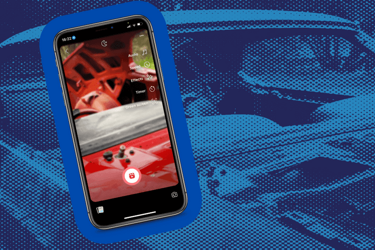 A smartphone taking a facebook reel of a car restoration in progress